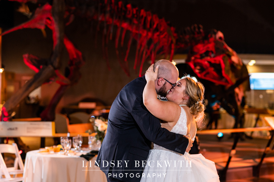 Cleveland Museum of Natural History wedding reception bride and groom first dance in front of dinosaur skeleton