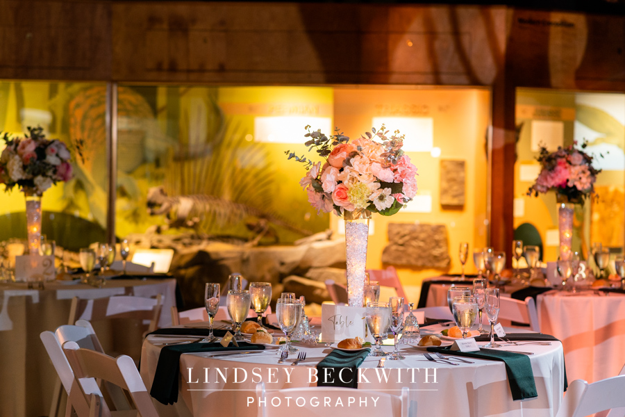 Cleveland Museum of Natural History wedding reception table centerpiece with white vase and pink flowers